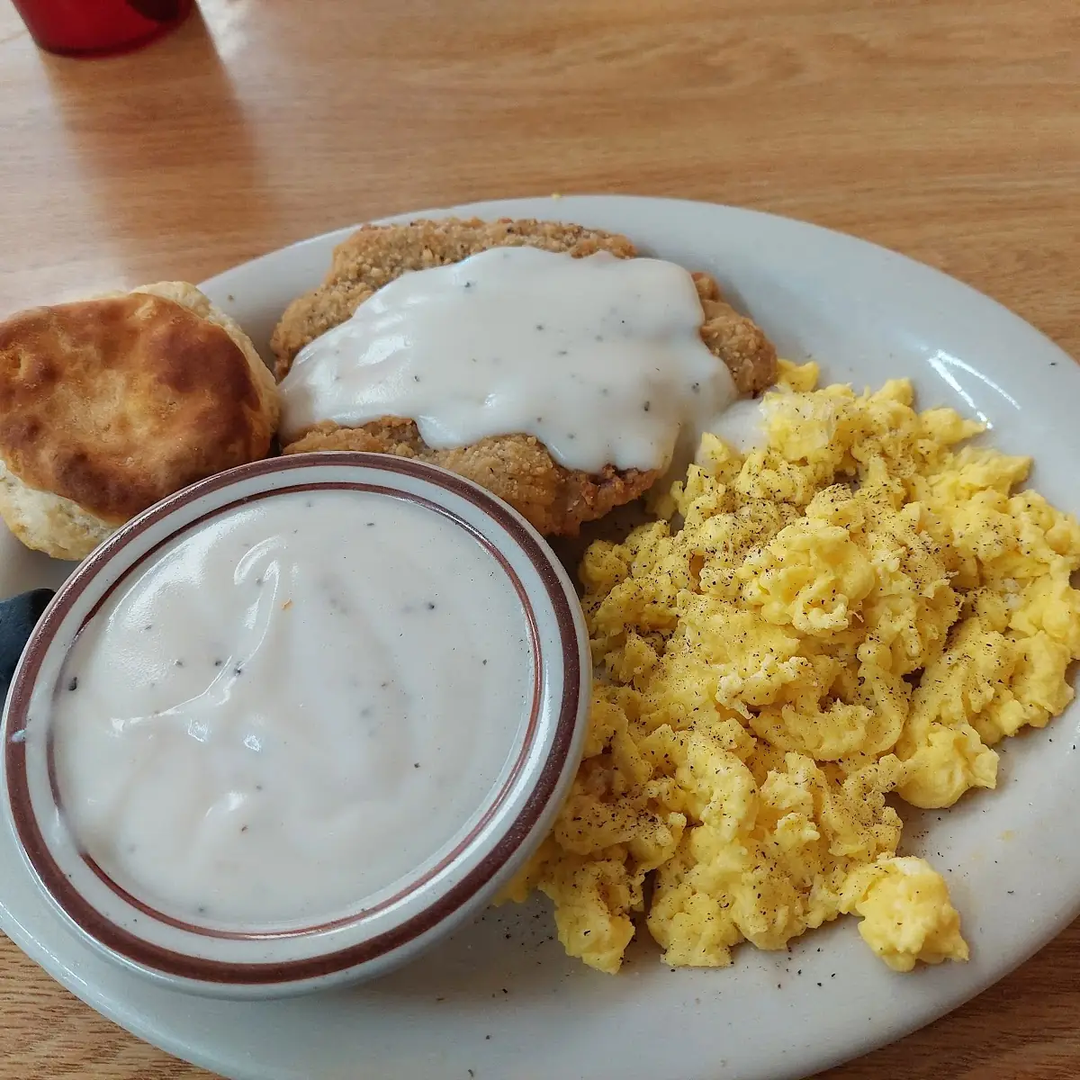 Three Eggs Country Fried Teak Biscuits and Gravys