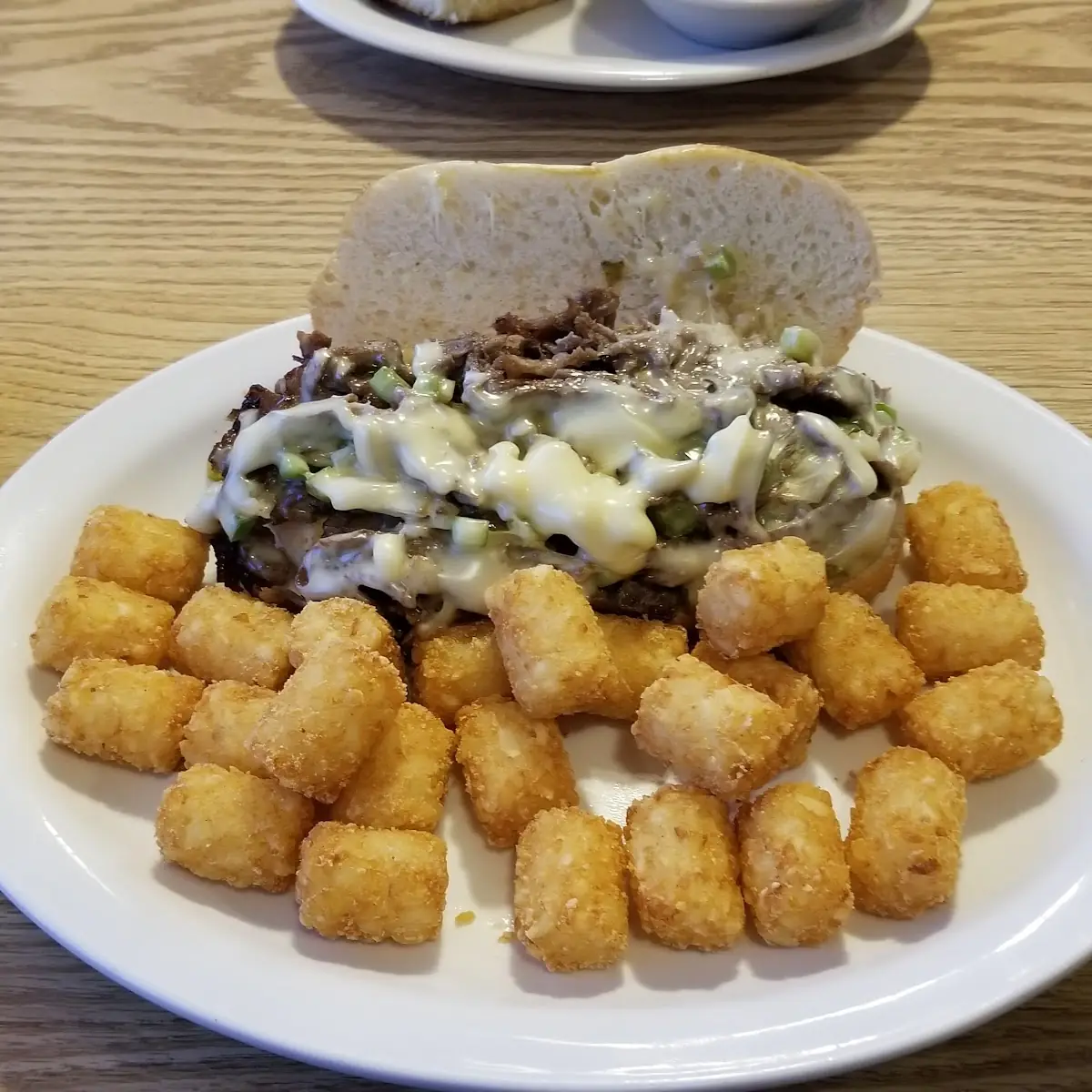 Philly Cheese Steak Sandwich and Tater Tots