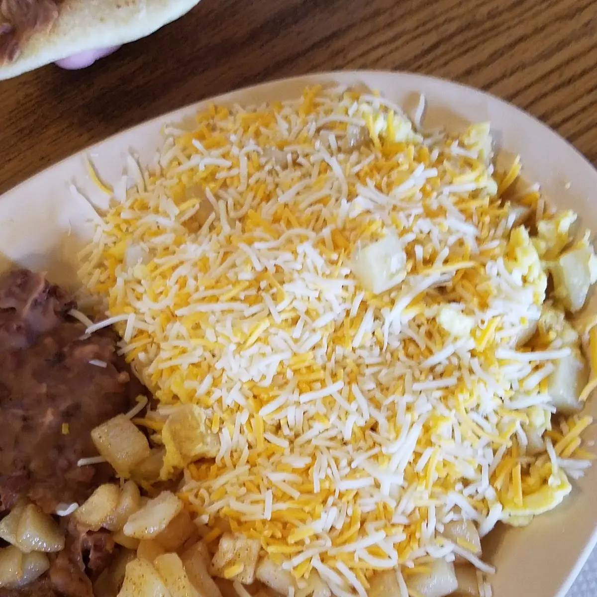 Scrambled Egg and Cheese with Potatoes and Beans