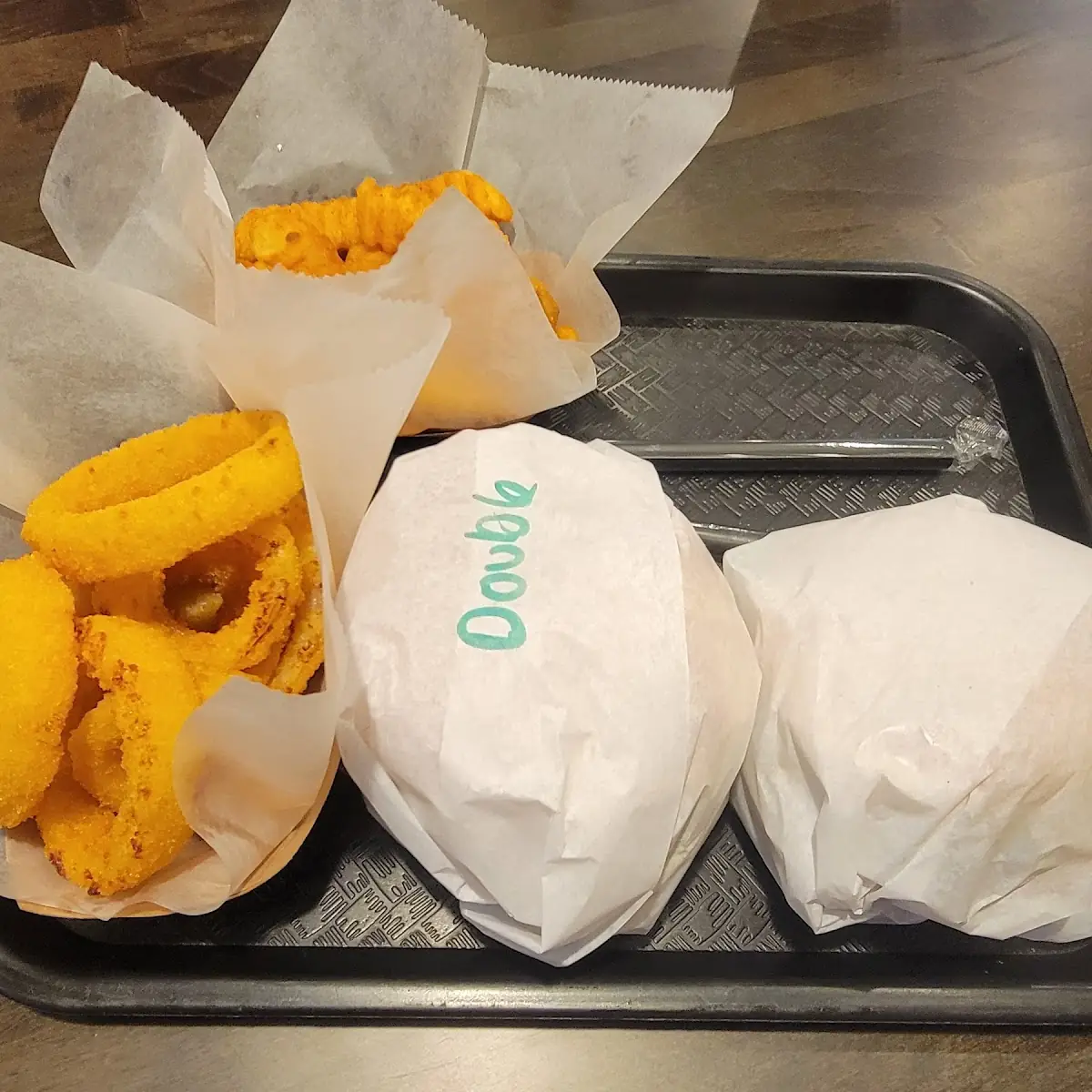 Double Cheese Burger Onion Rings Fries and a Single
