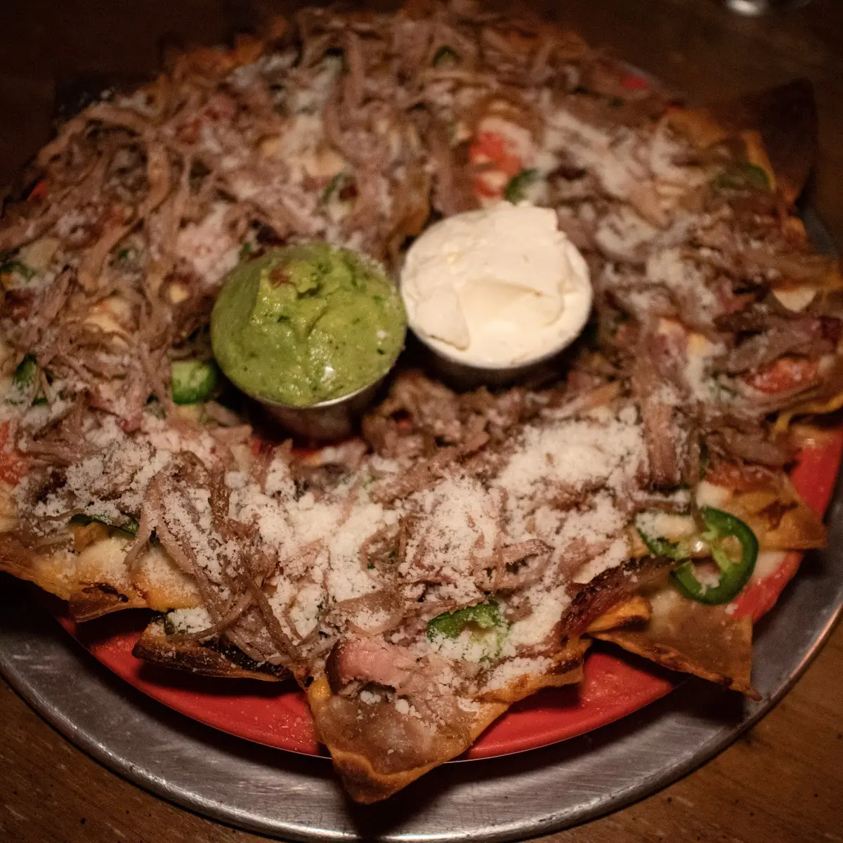 Pulled Pork Nachos with Queso Fundido and Cotija Cheese