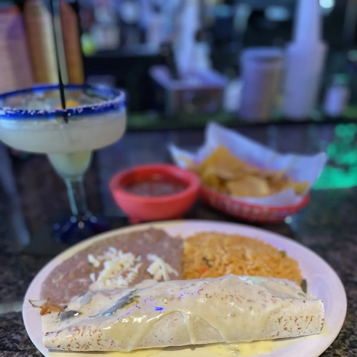 Stuffed Chicken Burrito Topped with Queso Sauce