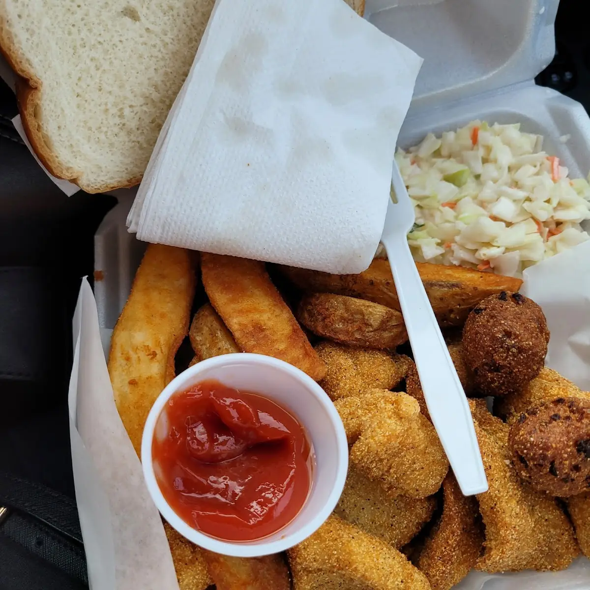 Catfish Dinner with Bread and Potato Wedges