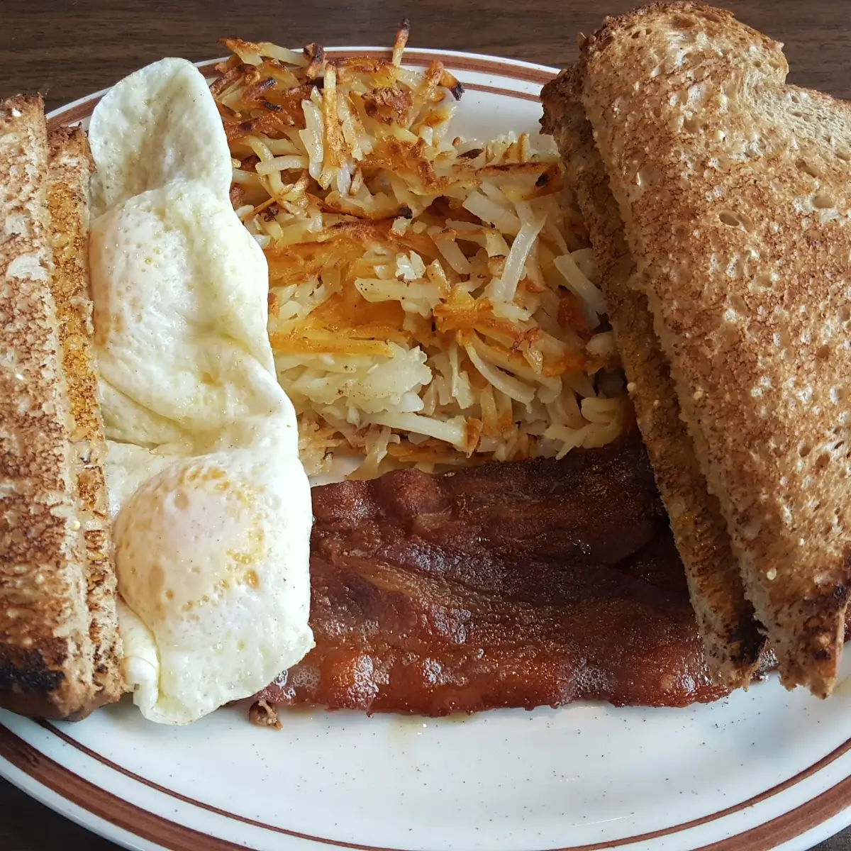 Two Eggs Bacon Hash Browns and Toast