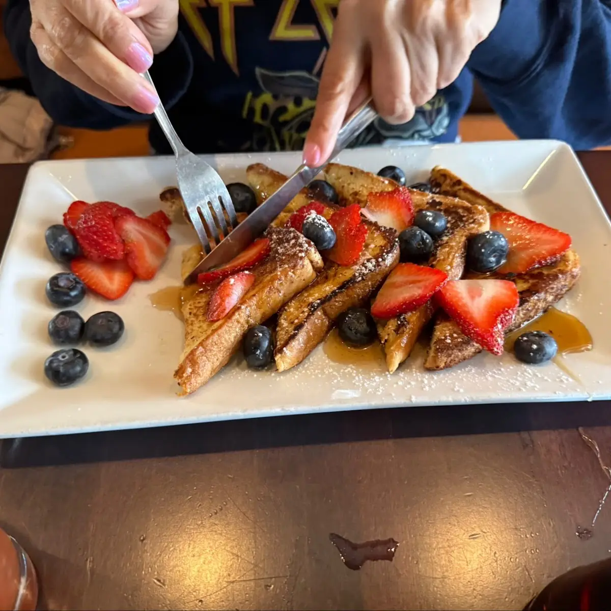 Cinnamon French Toast with Crispy Bacon Fresh Berries & Powdered Sugar