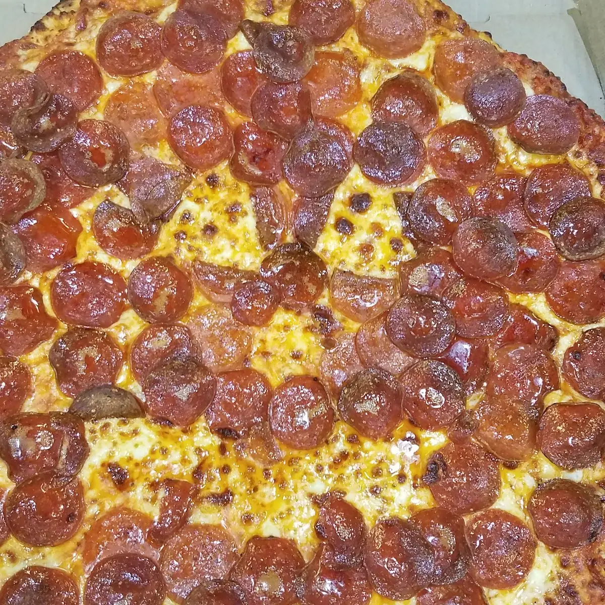 Cheese and Pepperoni Pizza with Sweet Sauce Made into a Pumpkin for Halloween