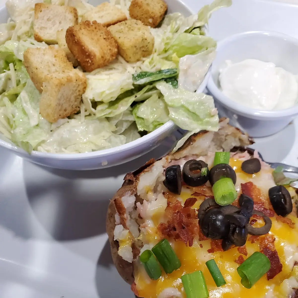 Loaded Baked Potato and Caesar Salad