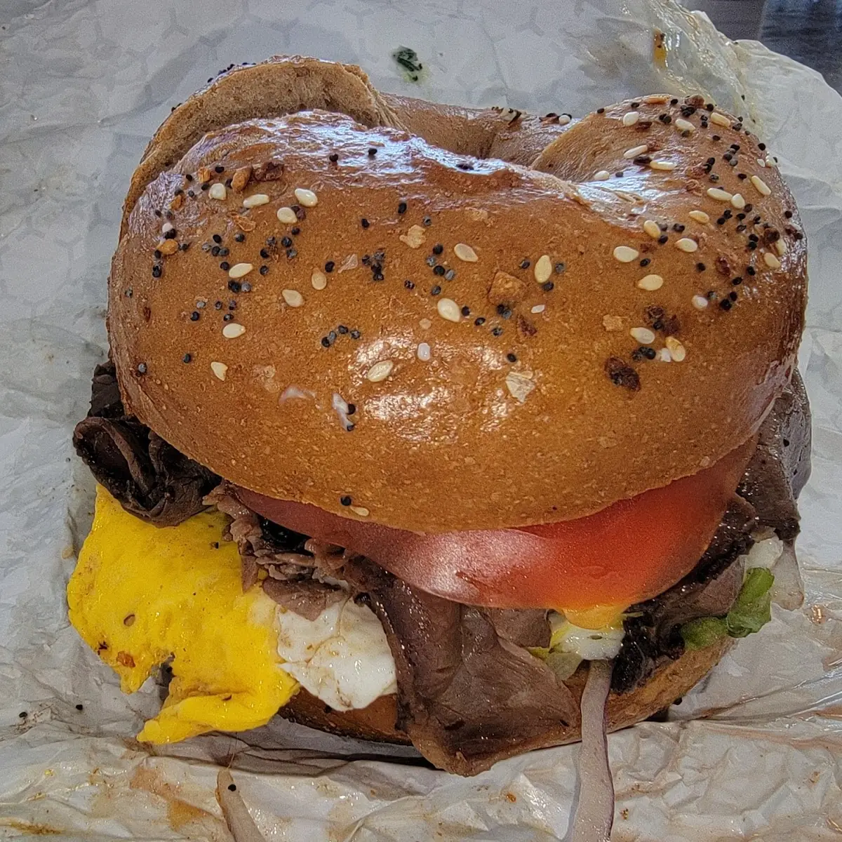 Steak Egg and Cheddar Cheese on an Everything Wheat Begel
