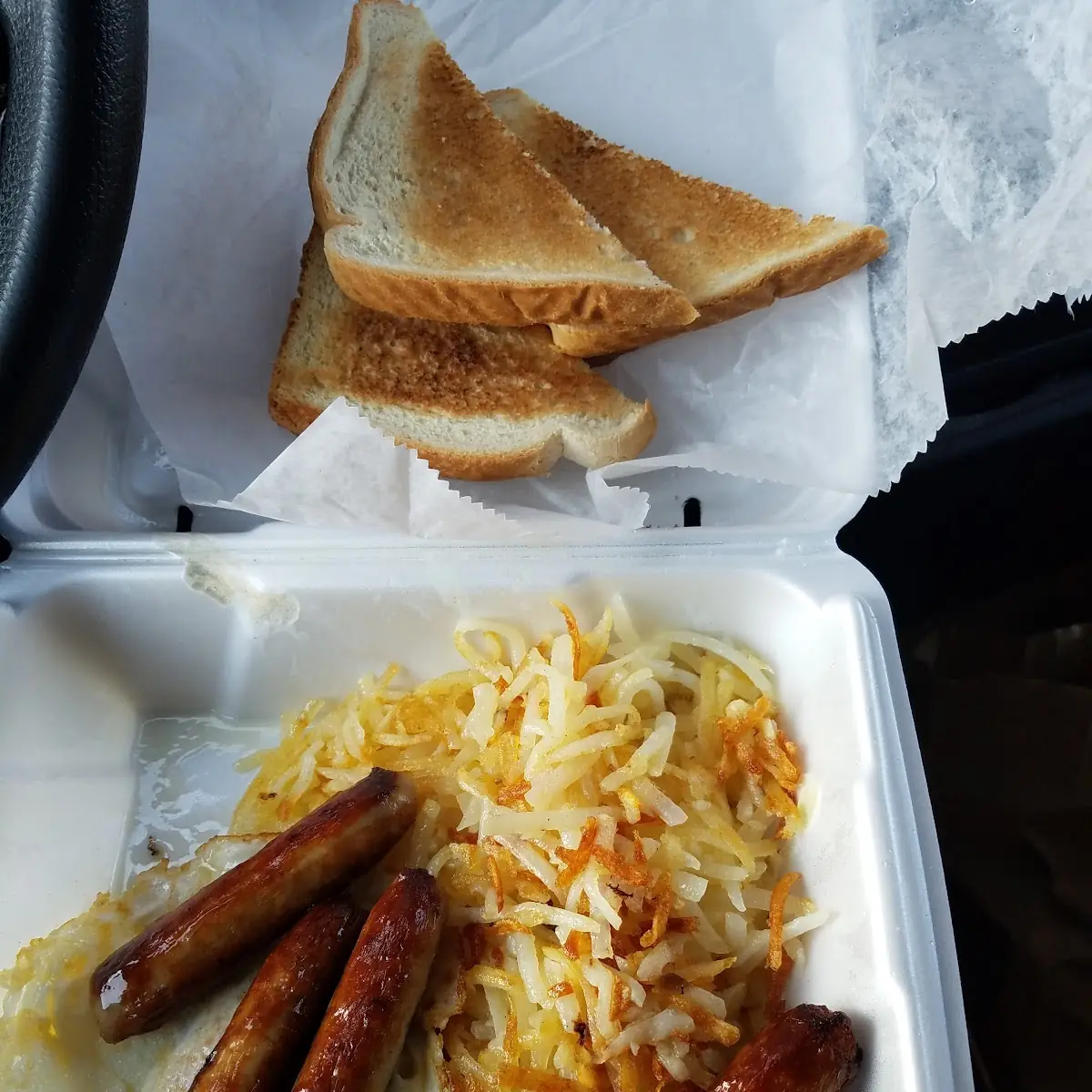 Eggs over Medium with Hash Browns Bacon and White Toast