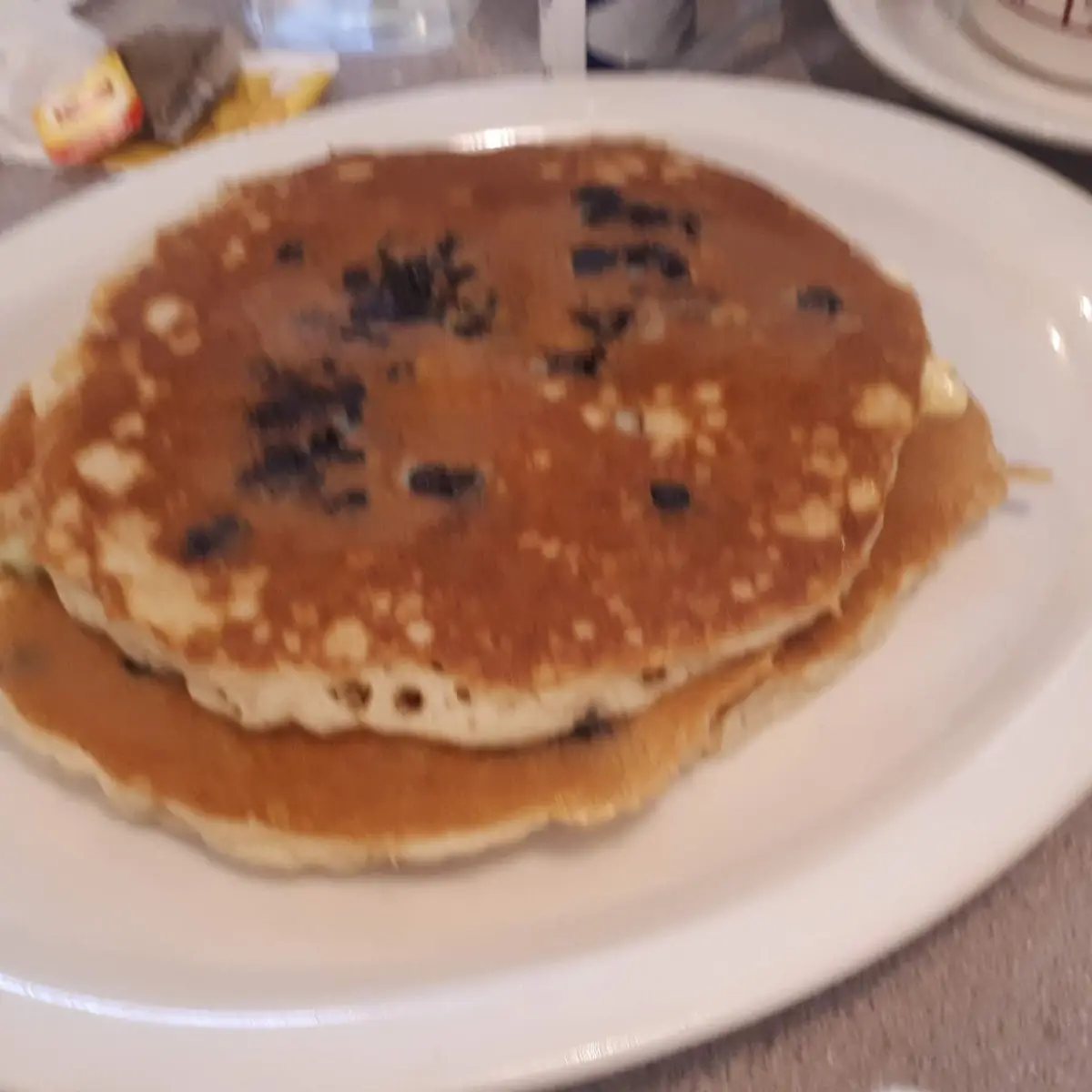 Blueberry, Banana or Chocolate Chip Pancakes with Syrup & Butter