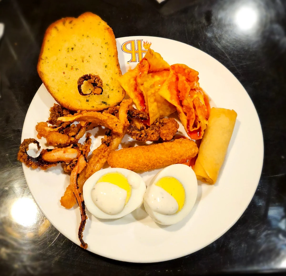 Fried Octopus Boiled Eggs Garlic Bread and Fried Taquitos