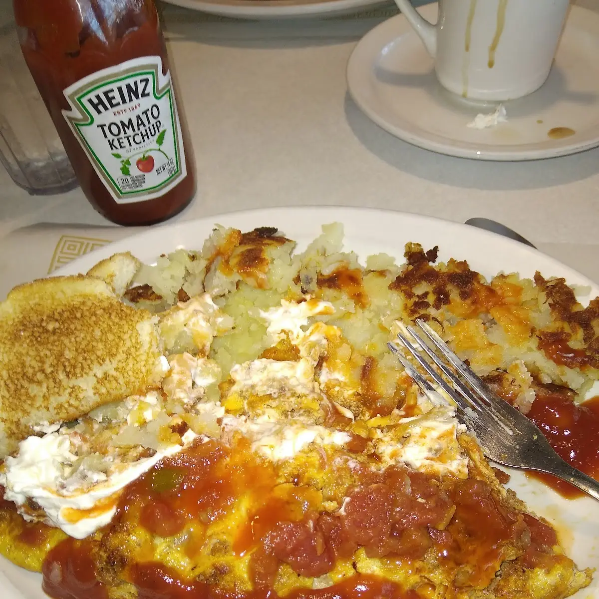 Scrambled Eggs with Hashbrowns and White Toast and Jelly