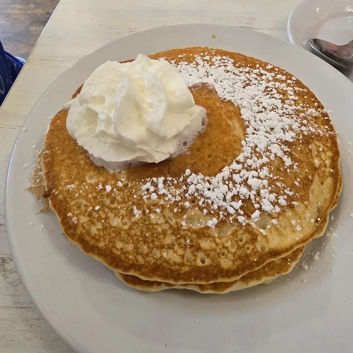 Stacked Pancakes with Whipped Cream