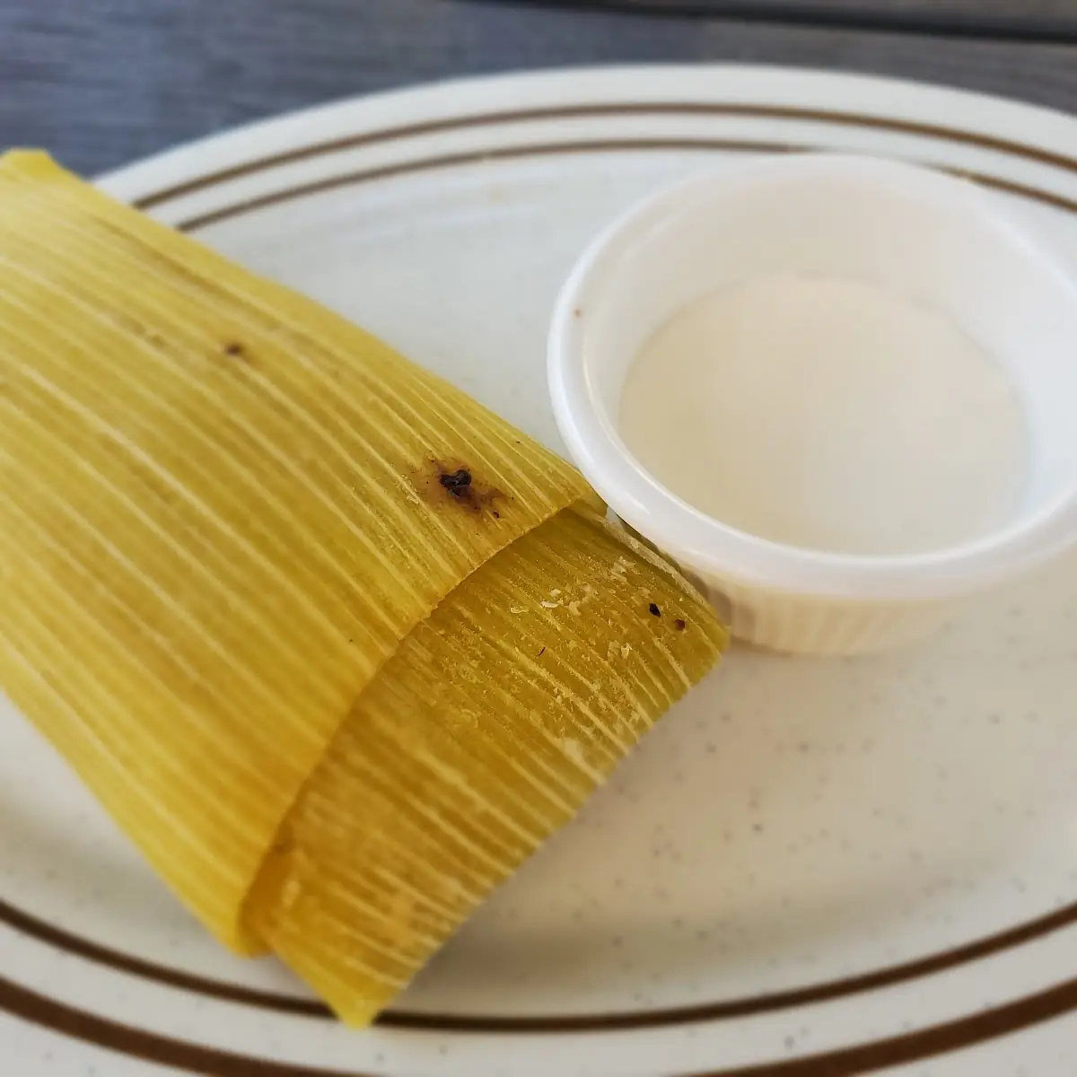 There Version of a Tamale Wrapped in a Banana Leaf