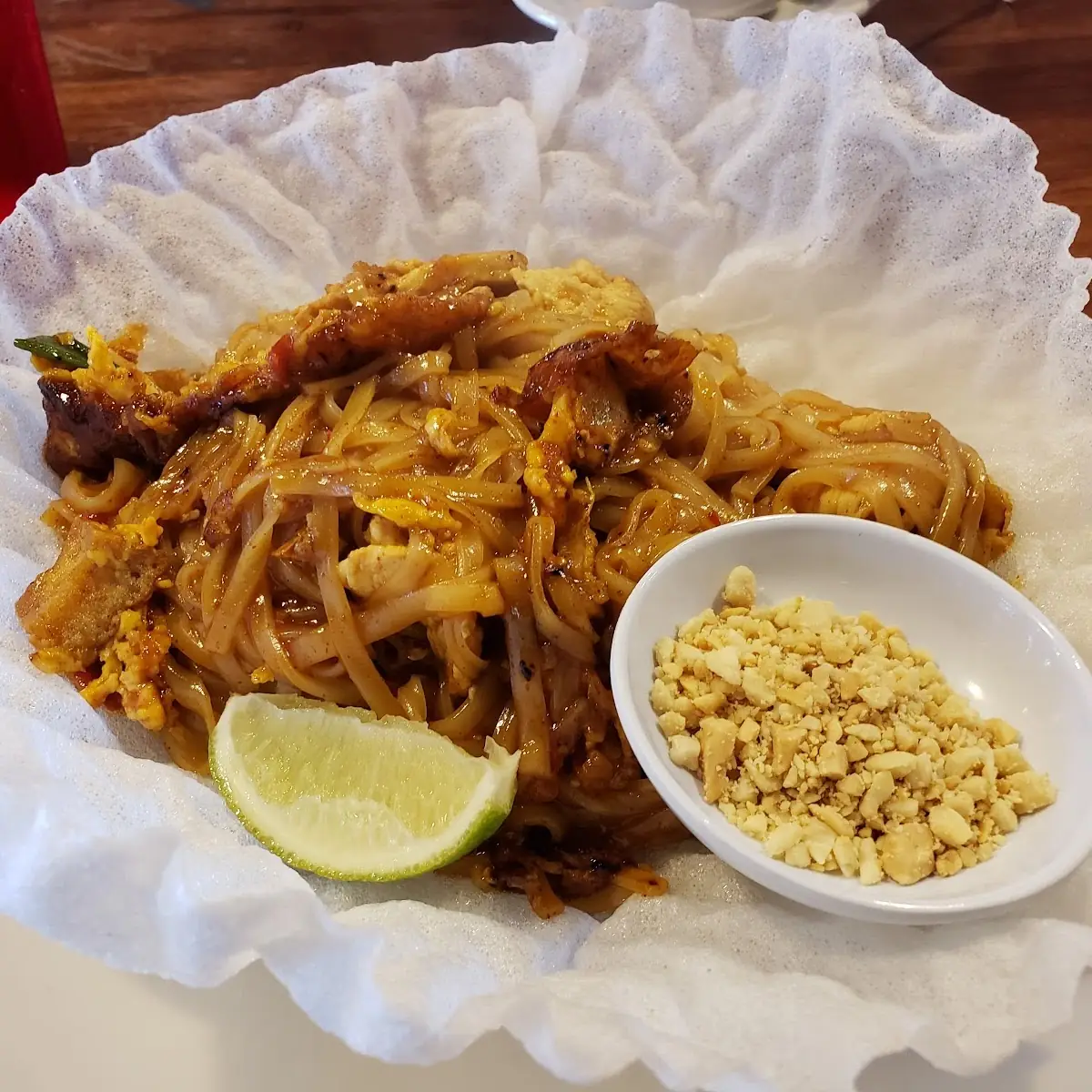 Pad Thai Chicken Served with Peanuts and a Lime
