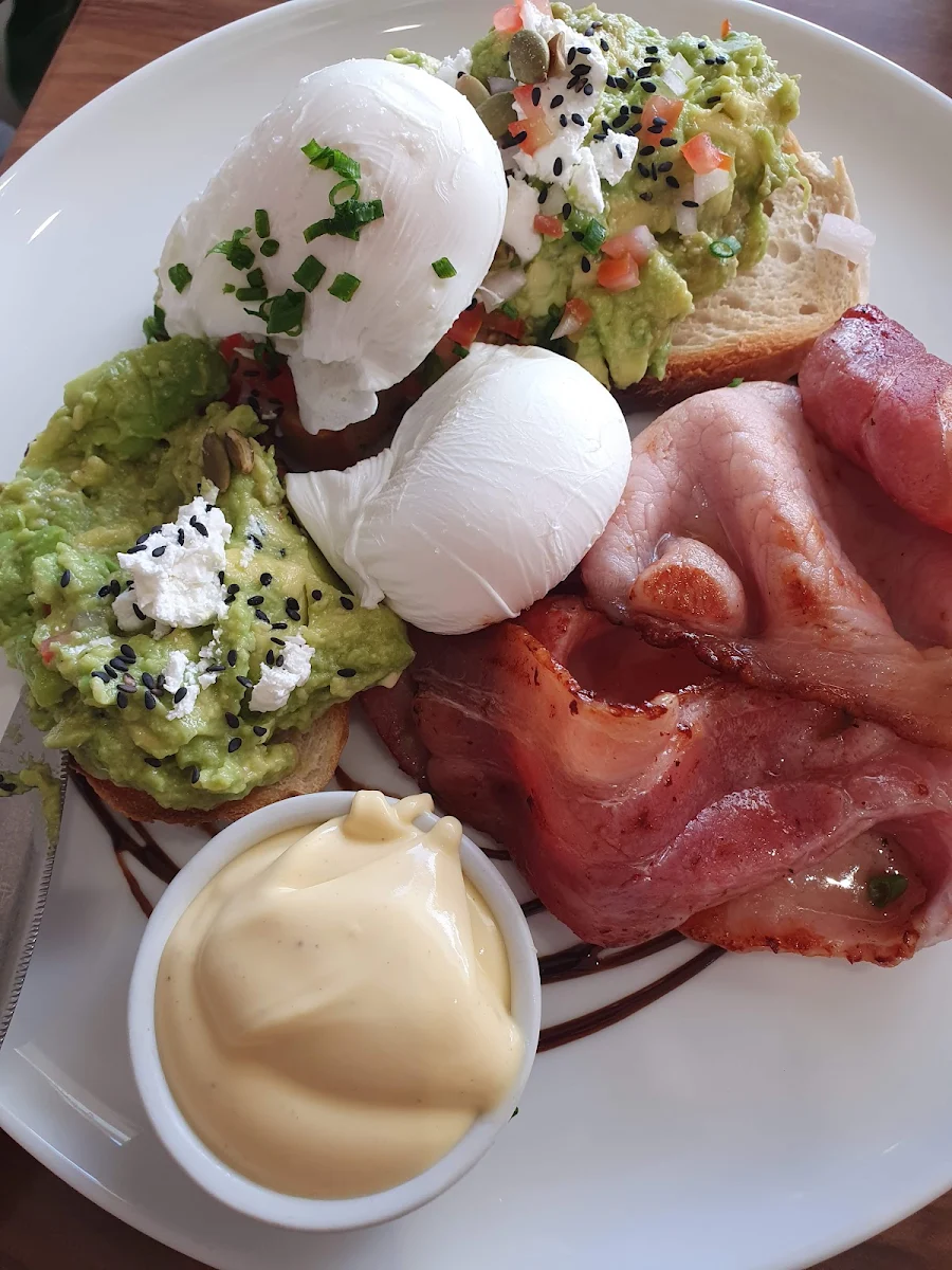 Smashed Avocado on Sourdough with Poached Eggs Bacon & Hollandaise, Double Shot Noosa