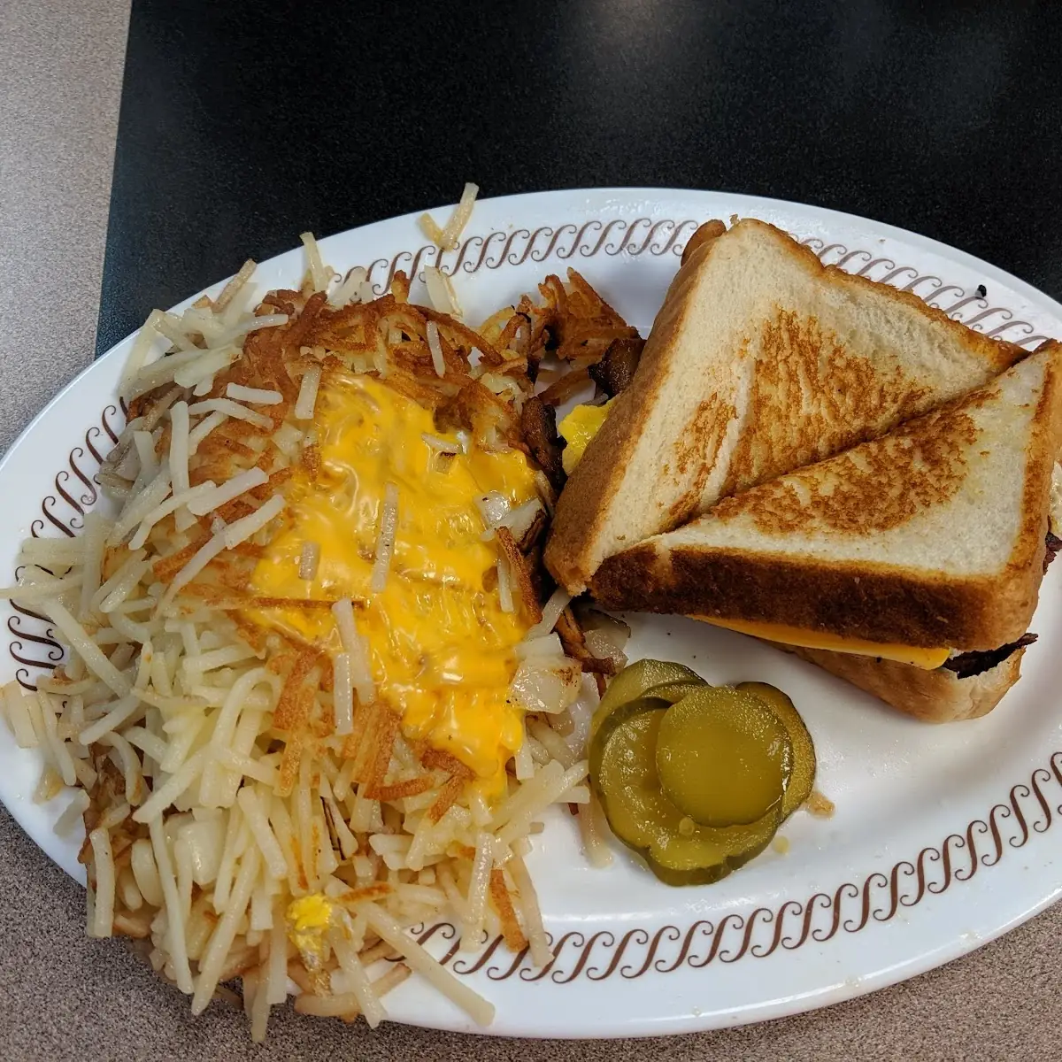 Bacon Egg and Cheese Melt with Double Hashbrowns Smothered and Covered
