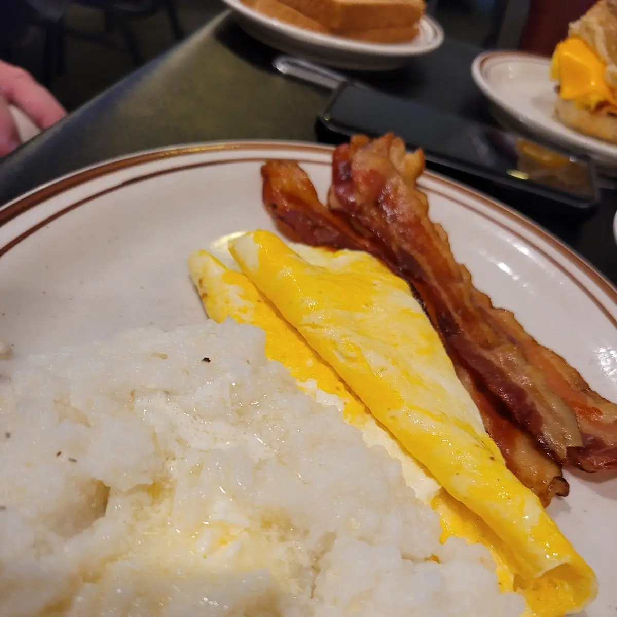Two Eggs with Sausage Grits