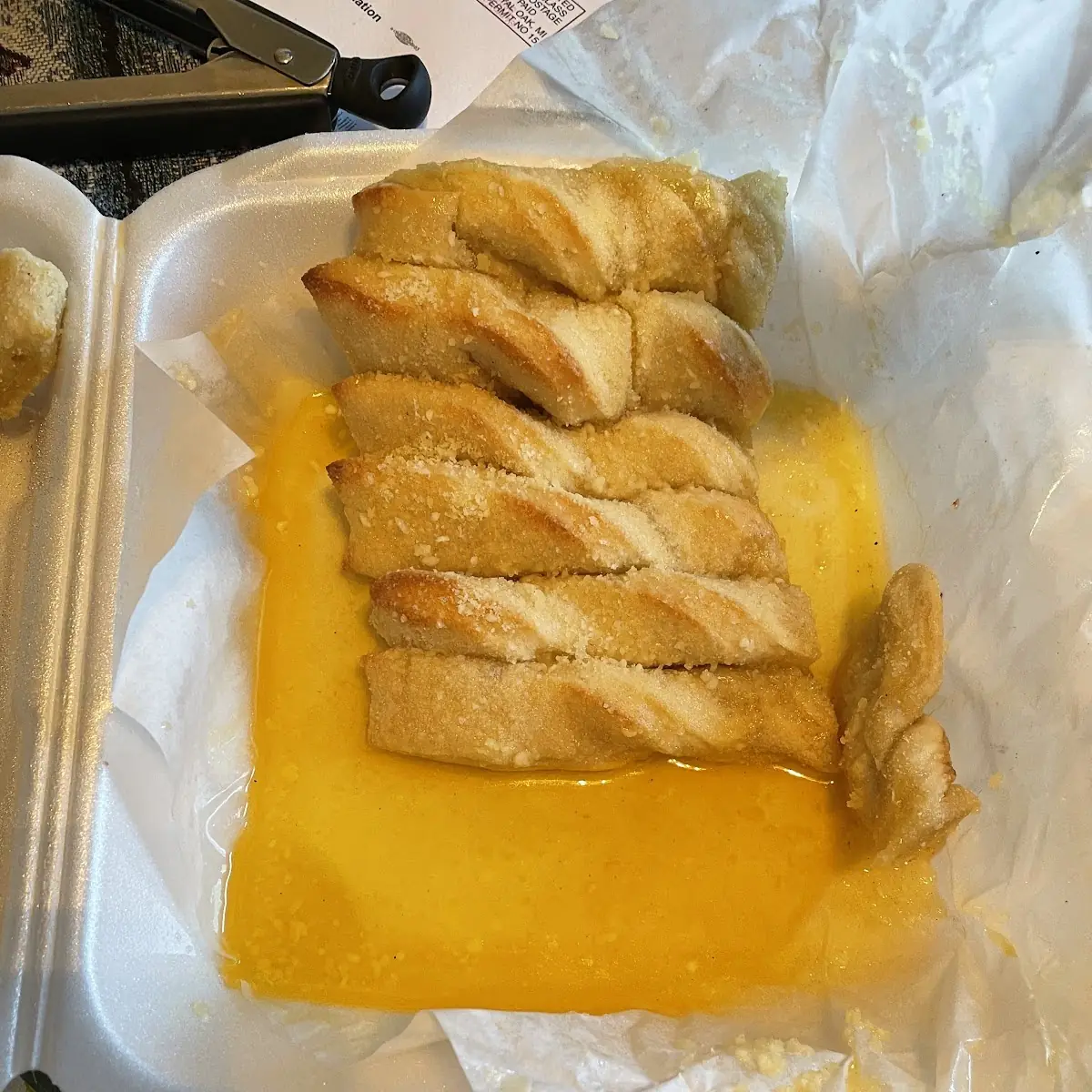 Bread Sticks Poured on Butter