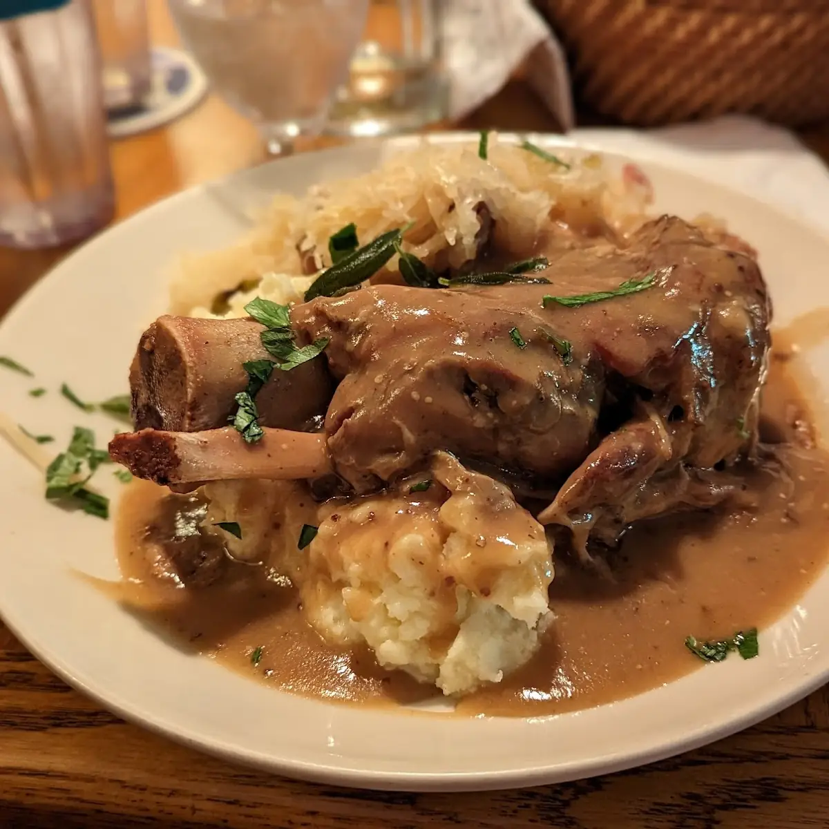 Pork Shank over Mashed Potatoes and Sauerkraut