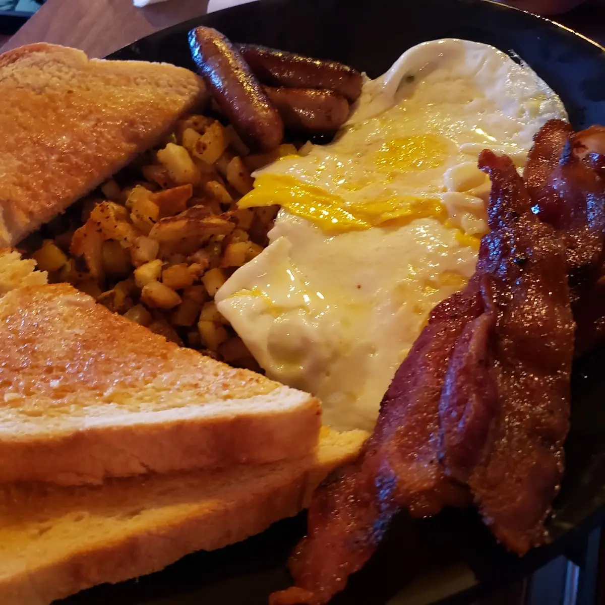 Basic Breakfast 2 Meat Choices Sausage & Bacon over Easy Eggs