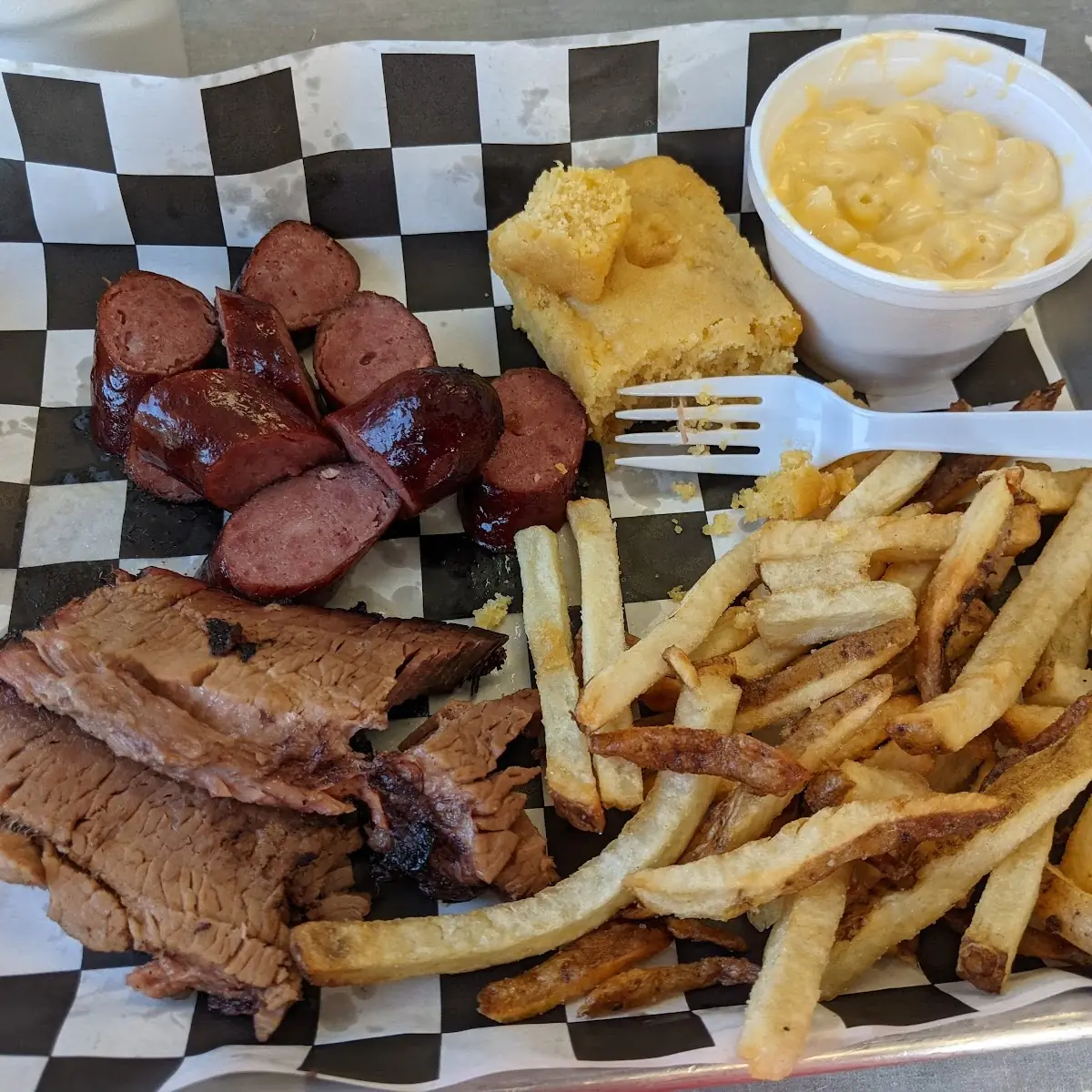 Brisket Plate with Polish Sausage Mac Cheese French Fries and Cornbread