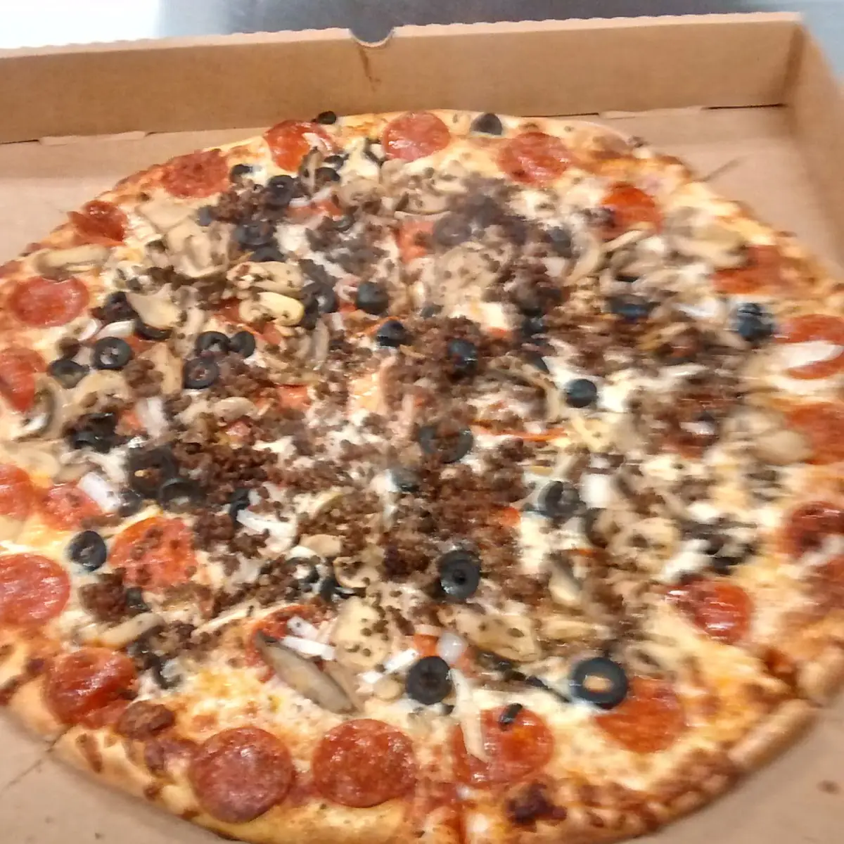 Pepperoni Sausage Mushroom and Black Olive Pizza