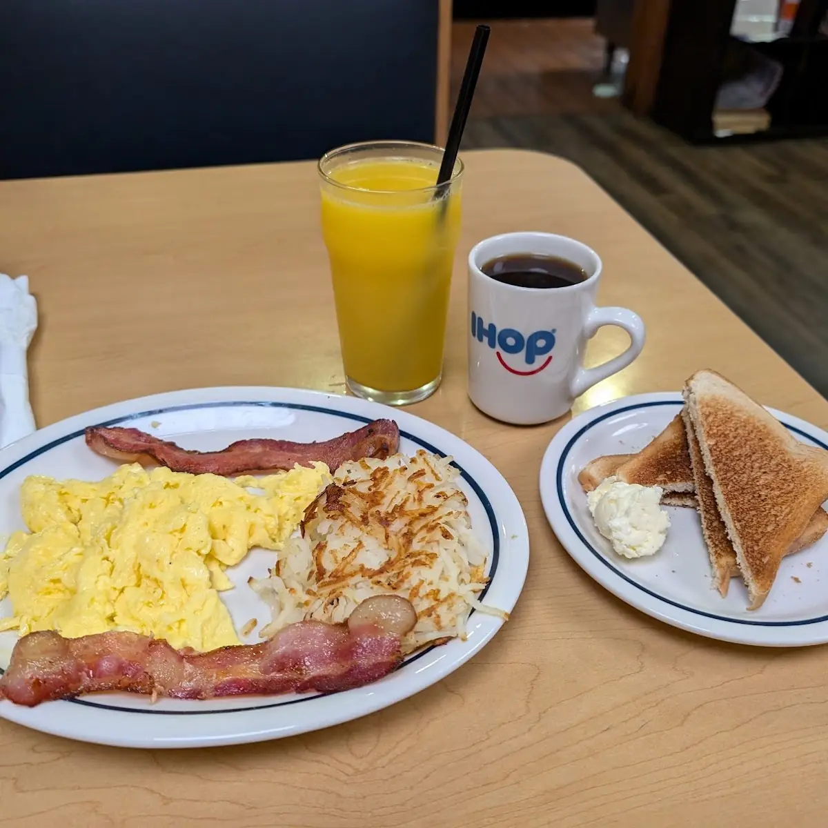 Scrambled Eggs Hash Browns and Bacons with White Toast
