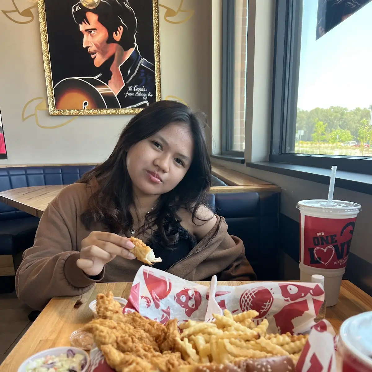 Enjoying Her First Time Cane’S Chicken Fingers