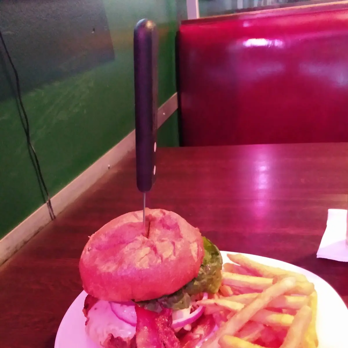 Hamburger with Bacon and Cheese with Leaf Lettuce and Red Onions