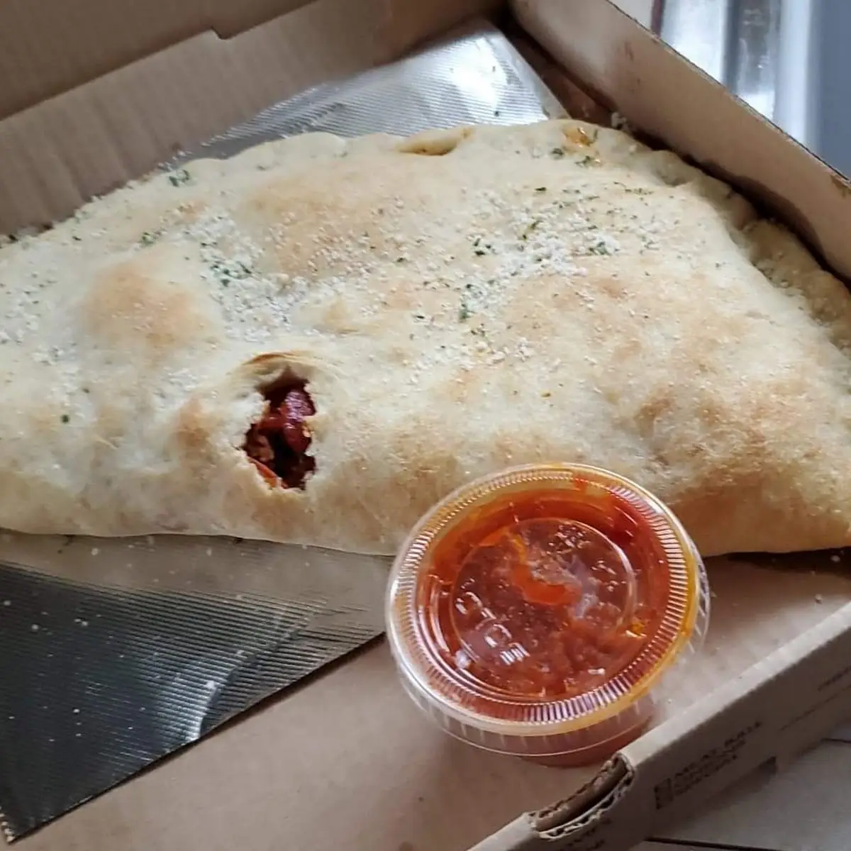 Three Toppings & Mozzarella Cheese Calzone