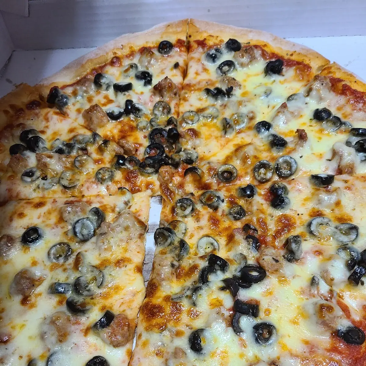 New York Style Sausage and Black Olive Pizza