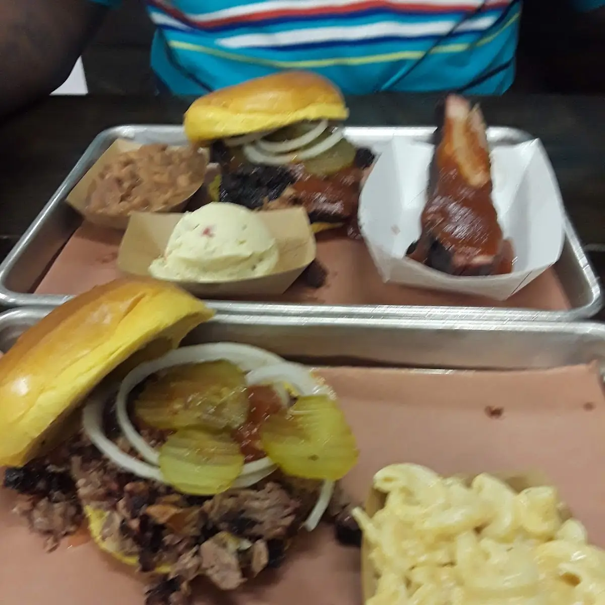 Chopped Beef with Mac& Cheese Sliced Beef Sandwich with Beans Potatoe Salad and a Rib