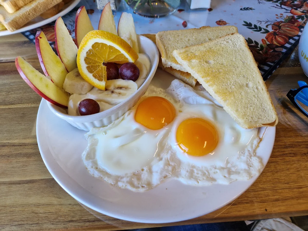 Two Eggs and Toast with Seasonal Fruit
