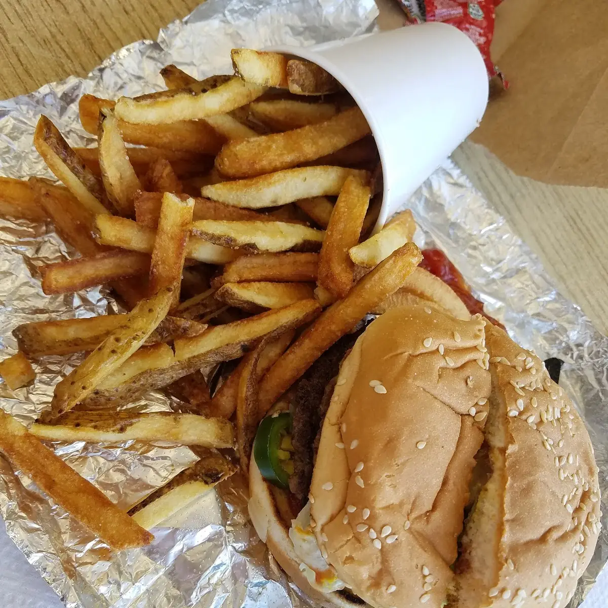 Cheeseburger with Grilled Onions and Jalapeños