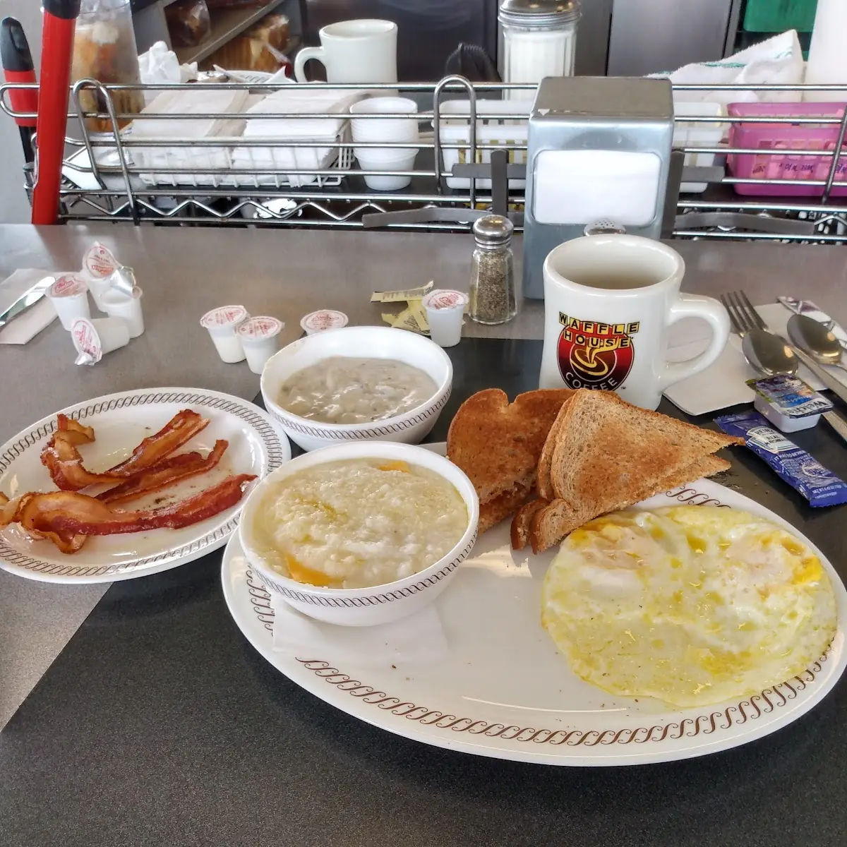 All Star Breakfast Plate with Bacon Cheesy Grits Wheat Toast and Side of Gravy