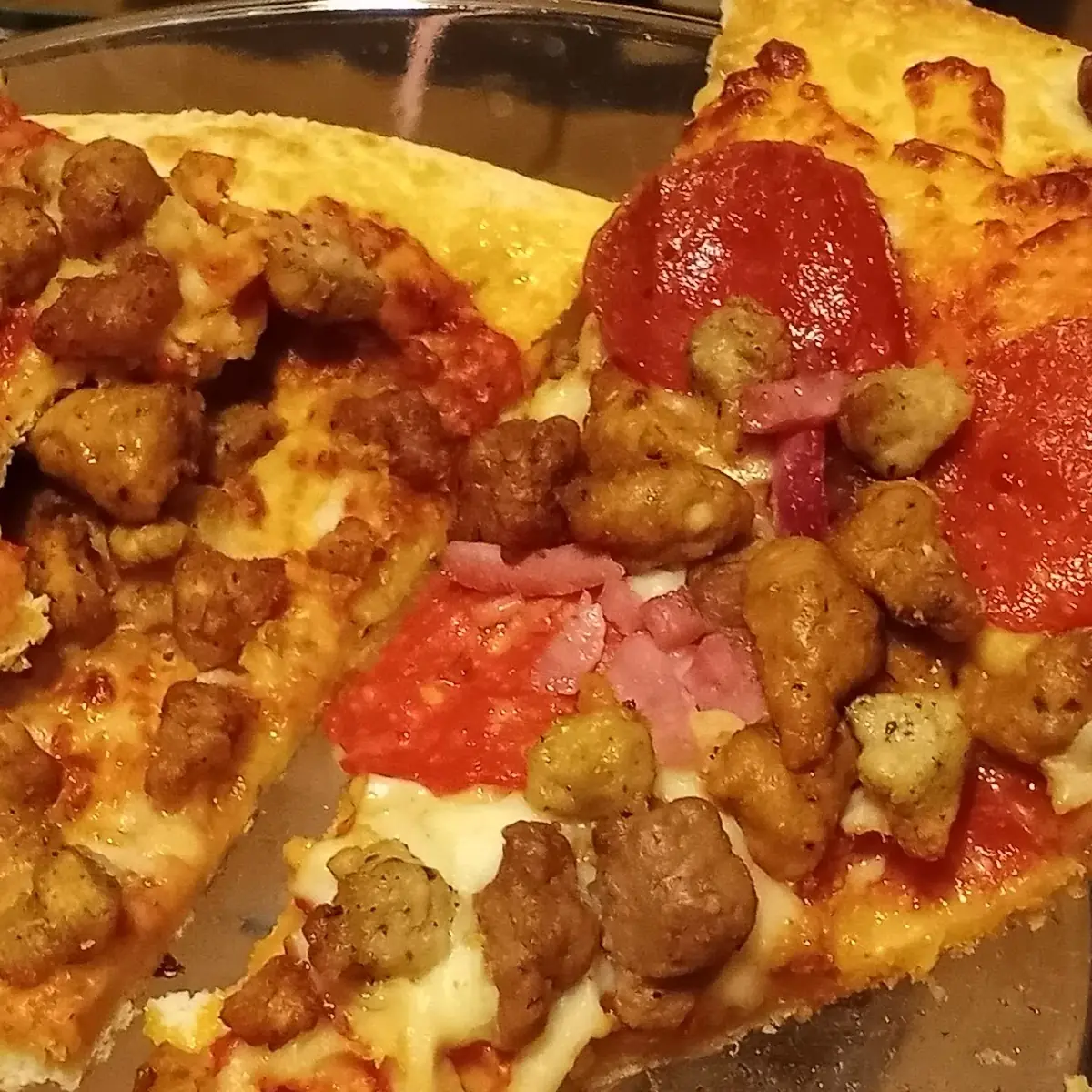 Meat Lovers Pizza Made in a Rush Toppings Thrown Everywhere