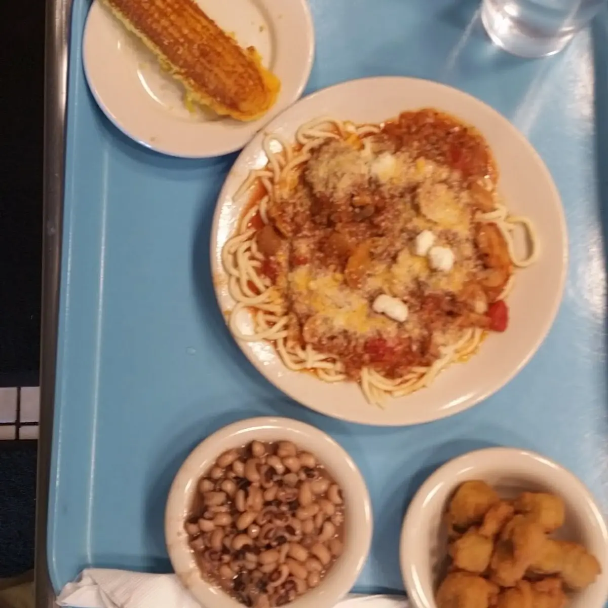 Spaghetti with Meat Sauce Topped with Parmesan Cheese