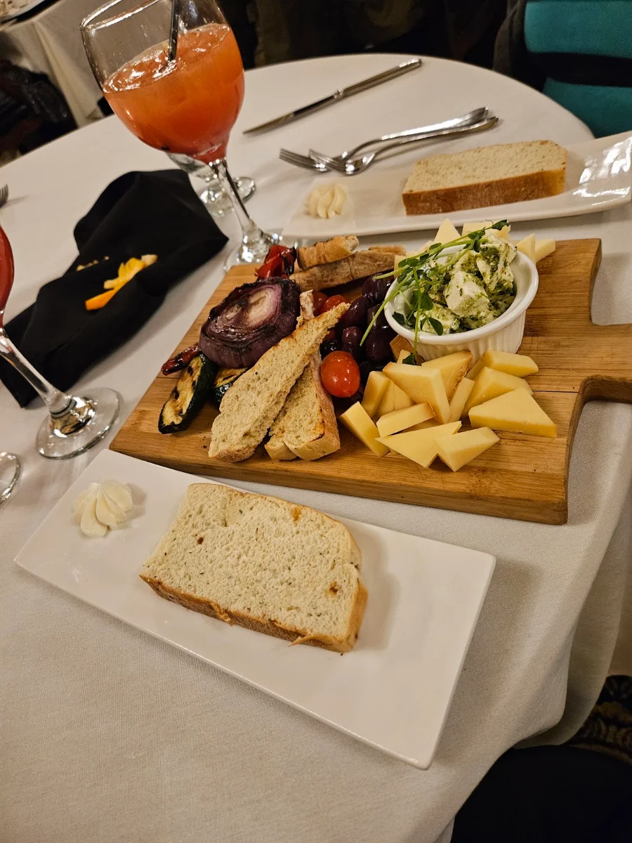 Cheese and Charcuterie Board Bread Olives Different Cheeses Peppers, Grant Hall Dining Room & Lounge