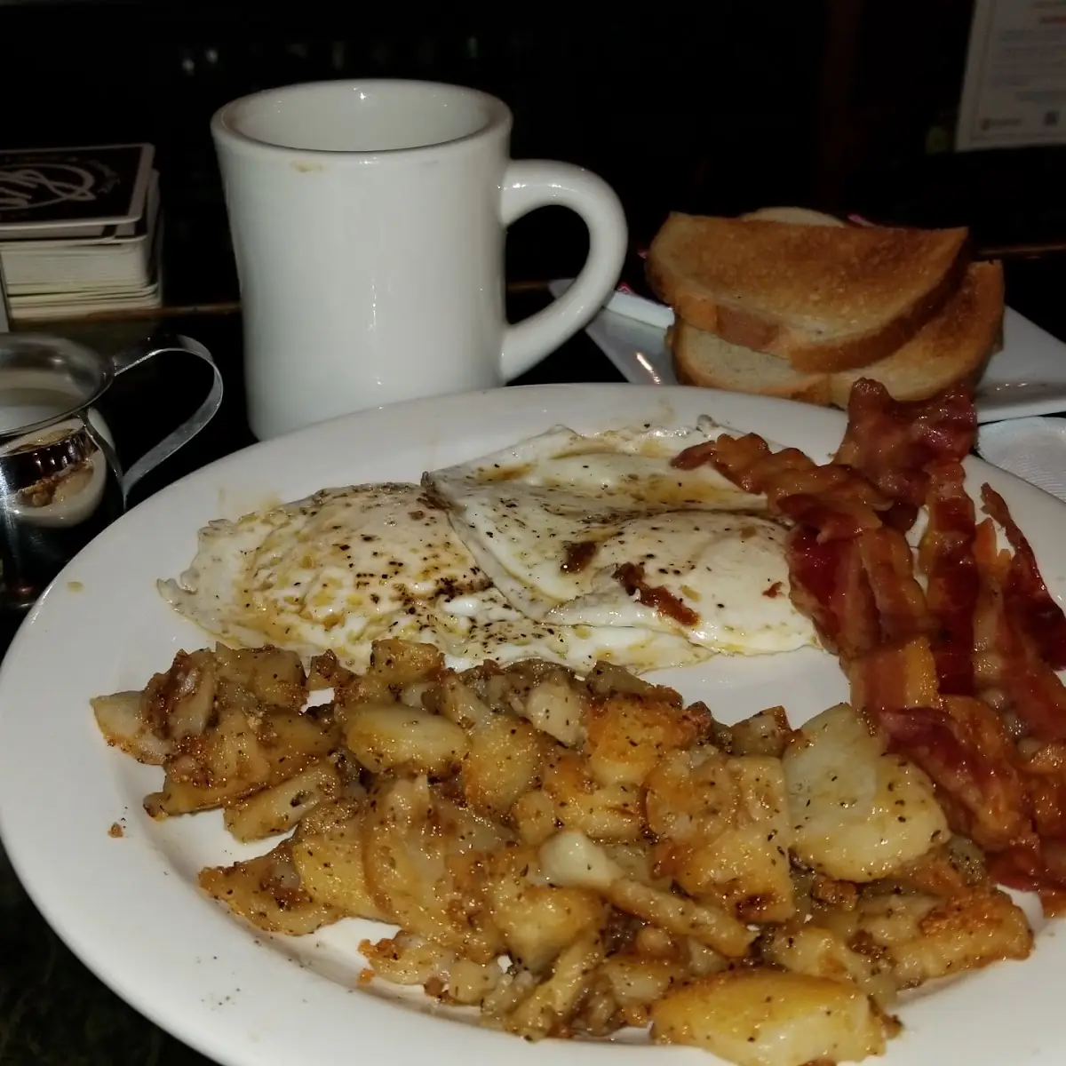 Bacon and Eggs with Hash Browns Rye Toast and Coffee
