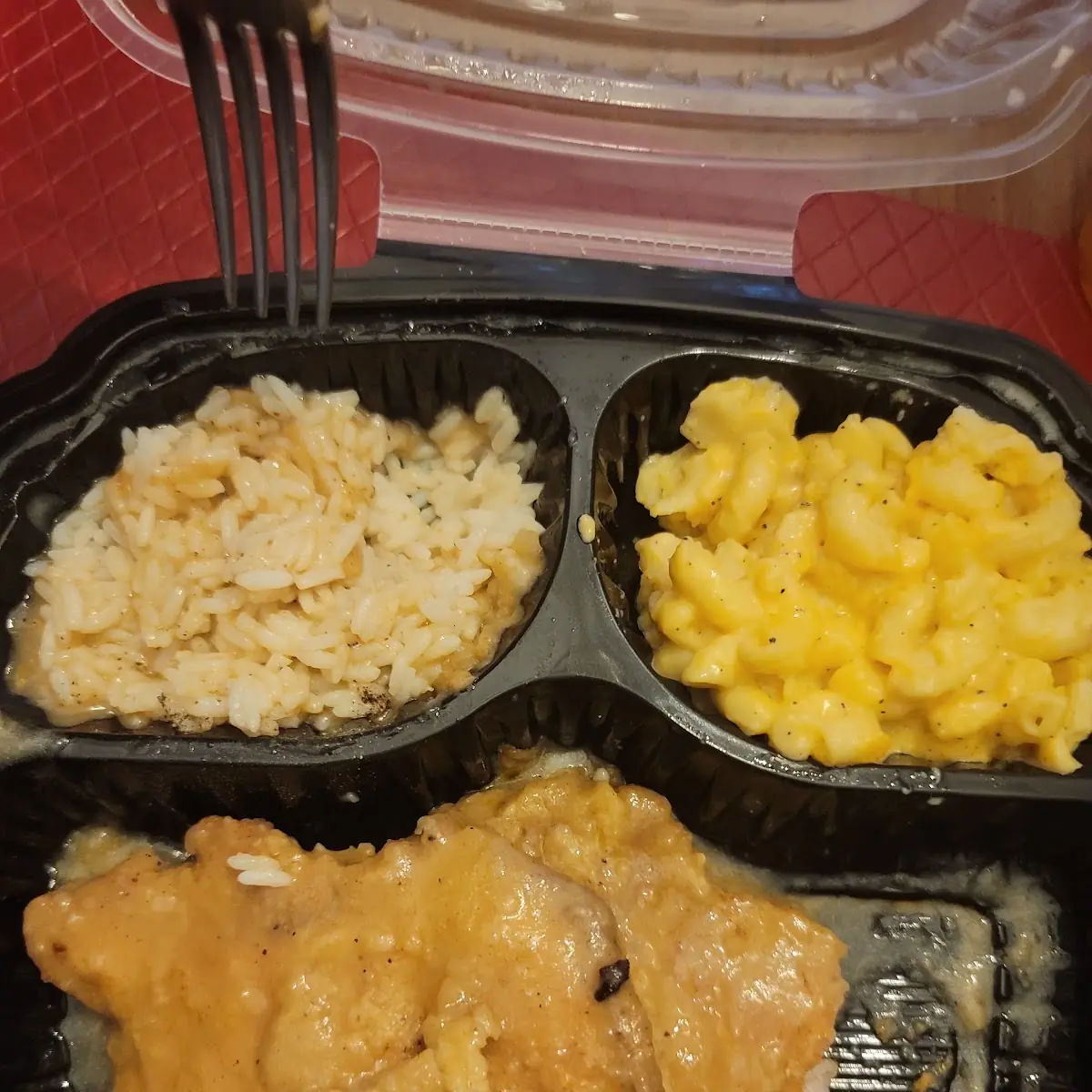 Smothered Pork Chops Mac & Cheese Rice & Gravy