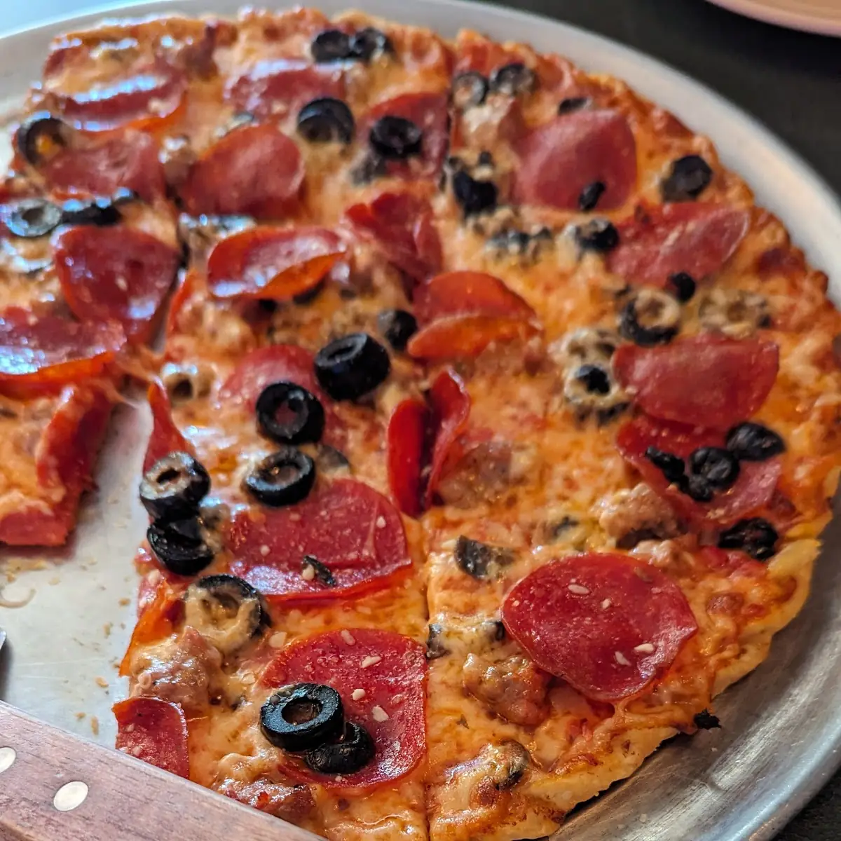 Sausage Pepperoni Black Olive Pizza