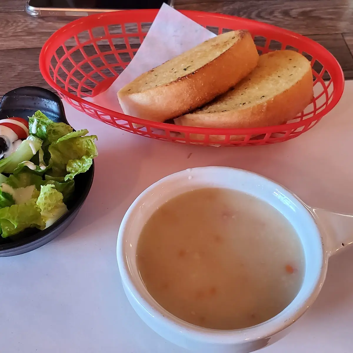 The Comes with Corn Soup and Garlic Bread