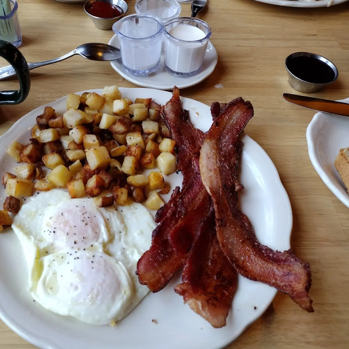 Corned Beef Hash Eggs Pancakes and Home Fries