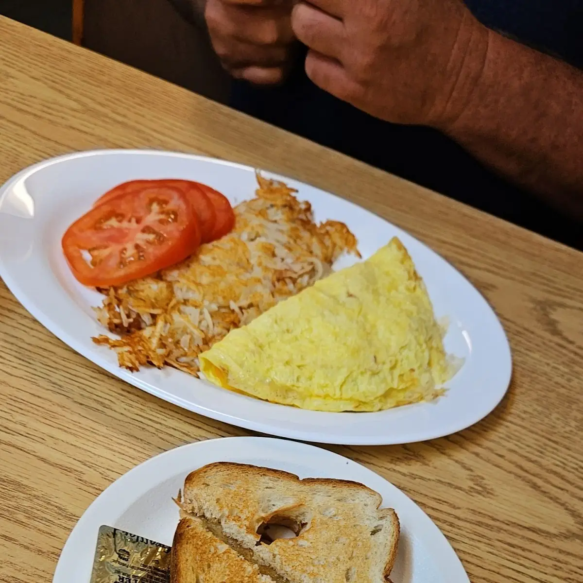 Omelet with Hash Browns and Sliced Fresh Tomatoes