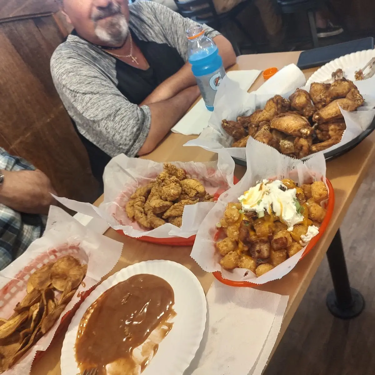 Berube Wings Cav'Ern Chips Chicken Tenders Loaded Tots