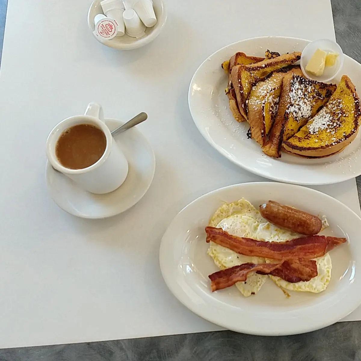 French Toast Deluxe with Two Eggs Bacon & Sausage