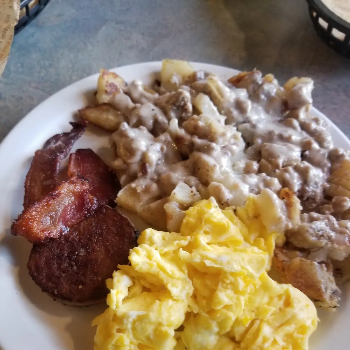 Scrambled Eggs and Gravy over Home Fries