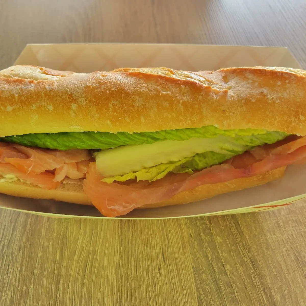 Avocado, eggs and cheese sandwich on toasted baguette