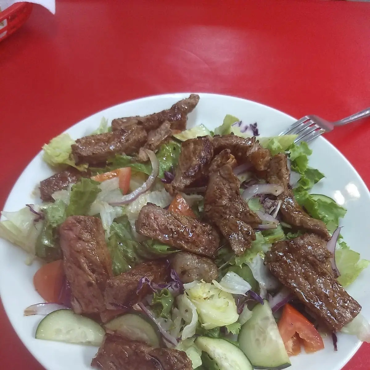 Steak over Spring Mix Salad